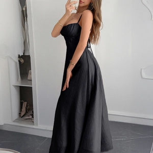 Slim fit black maxi dress with spaghetti straps and ruched texture for summer