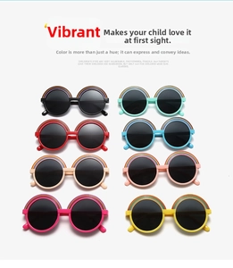 Detail view of round frame kids sunglasses with colorful rainbow print in eight vibrant colors
