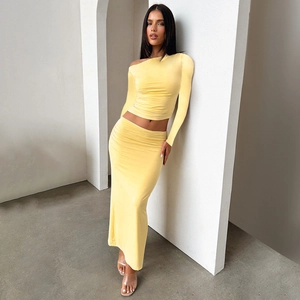 Detailed texture of vibrant yellow off-shoulder top and slim maxi skirt set