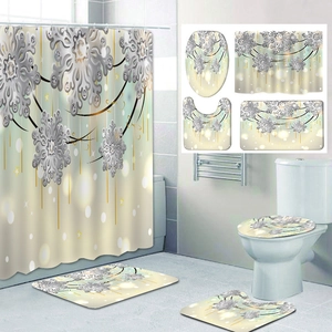 Detail of 4-piece bathroom set with elegant snowflake pattern and plush bath mats