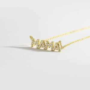 Polished gold MAMA pendant necklace with sparkling pavé crystals on a delicate chain