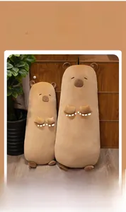 Macro detail of soft capybara plush pillow with closed eyes and cute brown snout