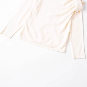 Minimalist long sleeve pleated wool top in creamy white, clean and modern casual style