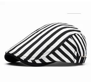 Detail view of the beige plaid pattern on a cotton newsboy cap with sharp texture