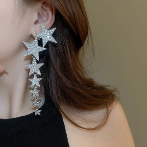 Long star tassel earrings with rhinestones shown on model for elegant face-shaping effect
