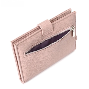 Detailed view of pale pink lychee pattern leather passport wallet with silver zipper
