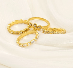 Detailed view of 18K gold plated ring set featuring honey bee and rhinestone accents