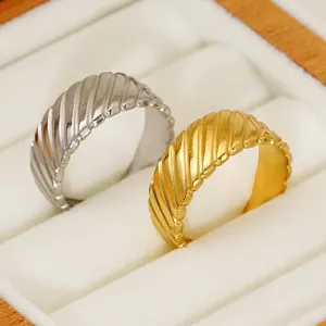 Elegant gold and silver twisted croissant rings in a minimalist stainless steel design