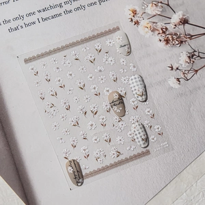 3D embossed nail art stickers featuring white camellia and daisy flowers on light base