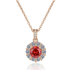 Champagne gold necklace with round floral pendant featuring red gemstone and white zircons