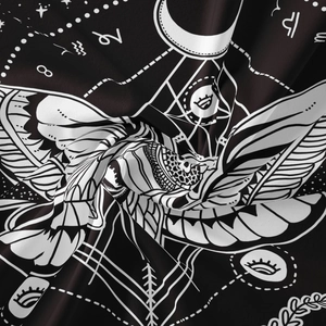 Macro view of bohemian moth tapestry showing soft polyester fabric with zodiac prints