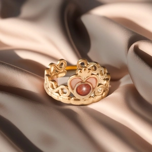Anime-inspired adjustable crown ring with red gemstone on golden silk background