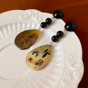 Boucles d'oreilles pendantes style chinois avec motifs élégants de bambou et fleurs