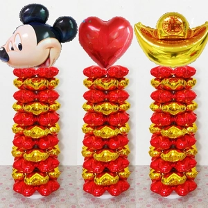 Detailed view of red and gold heart foil balloon pillars for Chinese New Year party decor