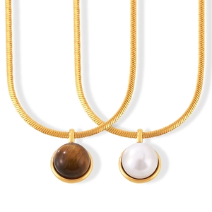 Vintage gold snake chain necklace featuring tiger eye stone and white pearl pendants
