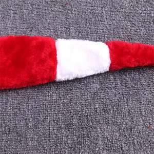 Macro shot of long plush Christmas hat showing red and white striped fabric texture
