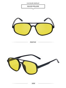 Detail view of double bridge pilot sunglasses with black frame and yellow tinted lenses