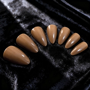 Glossy caramel brown almond shape press-on nails set in a radial fan layout