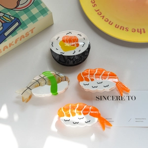 Creative sushi-shaped acetate hair claws set featuring salmon and shrimp designs