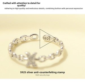 Macro shot of the S925 sterling silver hallmark on an adjustable chain ring with zircons