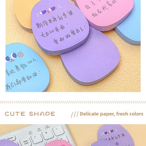 Close-up of cute cartoon shaped sticky notes with inspirational text and vibrant colors