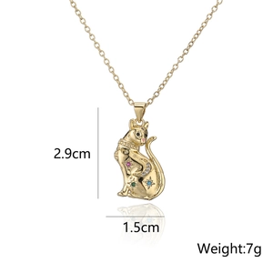 Macro shot of gold cat pendant with colorful zircon stones and dimensions 2.9cm x 1.5cm