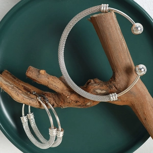 Chic silver woven mesh jewelry set featuring a bead open bangle and large hoop earrings