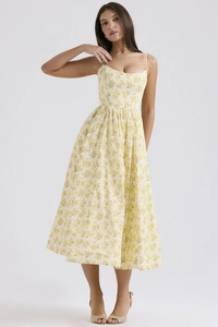 Detail of yellow floral midi dress with spaghetti straps and gathered waist design