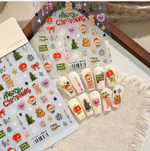 Detail of Christmas nail stickers with cute bears, trees and snowflake patterns