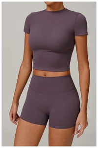 Detail view of high-waist yoga shorts and crop top in grey-purple brushed fabric