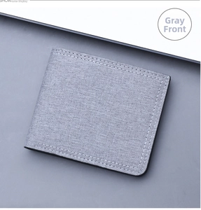 Close-up showing grey canvas fabric texture and white double-row stitching on men's wallet