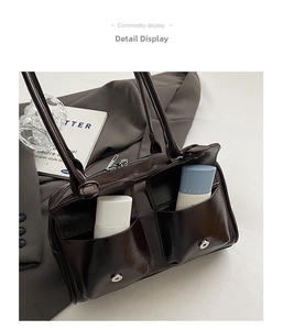 Detail shot of brown glossy bowling bag featuring functional front pockets and silver zippers