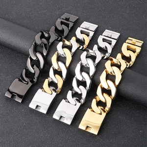 Detail of 30mm Cuban chain bracelets in silver and gold with clasp mechanism close-up