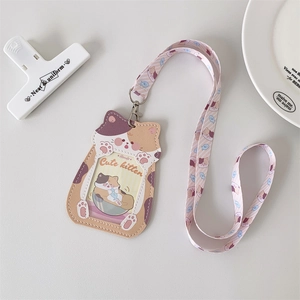 Detail of cute cat-shaped PU leather card holder with matching lanyard and pastel colors