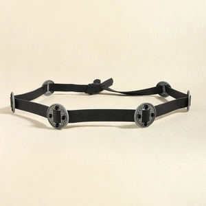 Detail of vintage black belt with silver circular medallions and embedded black stones