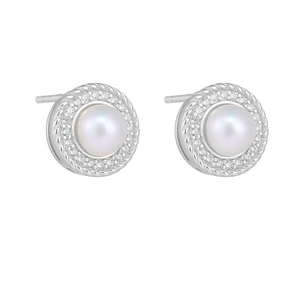 Macro detail of natural freshwater pearl earrings with micro-pave cubic zirconia accents