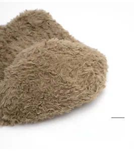 Detail of sturdy crown stitching on a plush brown winter beanie for durable daily wear