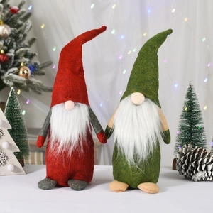 Pair of Christmas gnomes with pointed hats and soft beards in a festive scene
