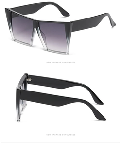 Detail view of square gradient frames and thick temples on futuristic cat-eye sunglasses