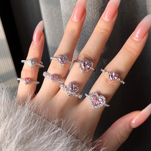 Elegant S925 sterling silver ring with pink heart zircon stones on a model's hand