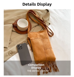 Detail view of brown faux suede crossbody bag featuring long fringes and stitched seams