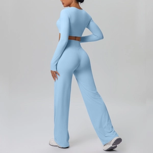 Close-up of high-waist slimming flare yoga pants and long sleeve top in light blue
