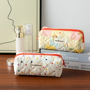 Quilted cotton pencil case with colorful patchwork and polka dots for stationery storage