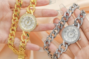 Close-up of Cuban chain fashion watches with sparkling rhinestones and Roman numerals