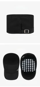 Detail of adjustable metal buckle and black and white checkered lining on cotton army cap