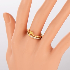 Double layered gold heart ring with white zircon stones on mannequin hand