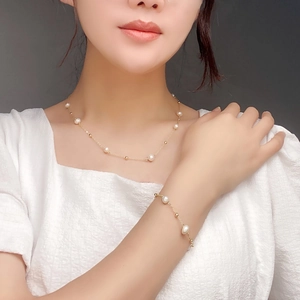 Elegant natural pearl necklace and bracelet set with golden beads for women