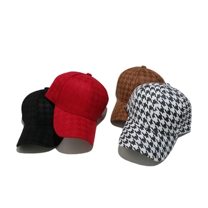 Women's houndstooth baseball caps in black, red, and brown on a white background