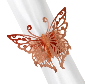 Close-up of rose gold butterfly napkin ring with intricate laser-cut metal detail
