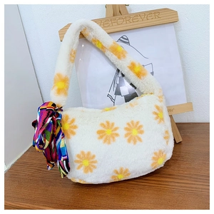 Detailed shot of white plush underarm bag with daisy patterns and colorful silk scarf decoration
